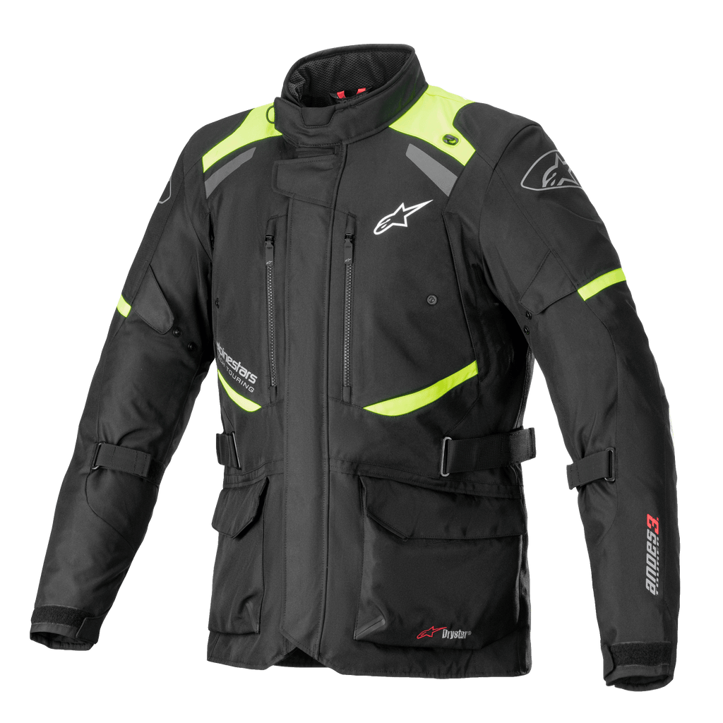 Alpinestars Andes V3 Drystar Jacket, Motorcycle Touring Jacket, Black with Fluorescent Yellow accents, featuring zippered chest vents, large front cargo pockets, adjustable waist straps, and Alpinestars branding, technical waterproof adventure gear