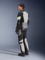 Alpinestars Andes Air Drystar® Jacket, touring motorcycle jacket, Ice Gray and Dark Gray with Black panels and neon yellow accents, worn with matching pants and gloves, rear three-quarter view showing mesh ventilation and Alpinestars branding.