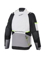Casaco Alpinestars Stella Andes V4 Drystar®, casaco de motociclismo de aventura para mulher, cinzento gelo, cinzento escuro e preto com detalhes em amarelo fluorescente, vista traseira com grande bolso posterior e logótipo Alpinestars