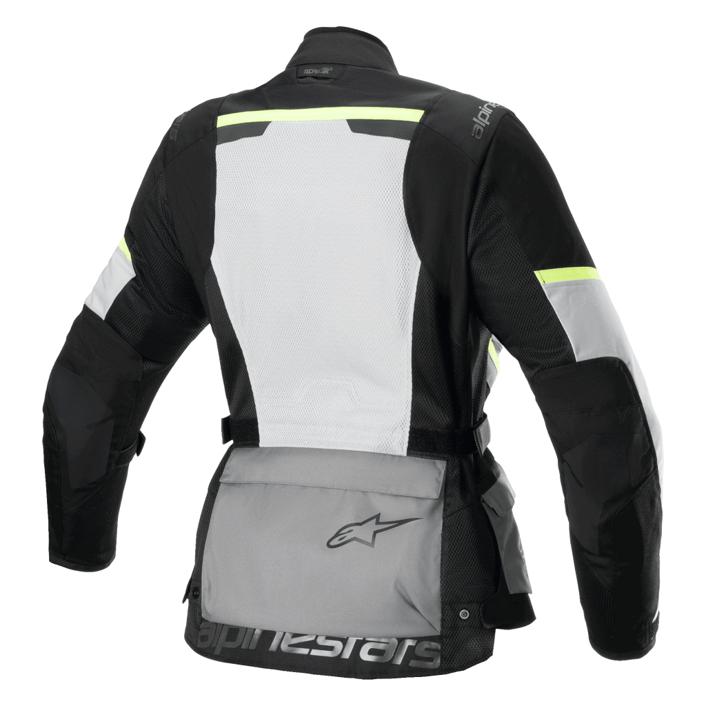 Alpinestars Stella Andes Air Drystar® Jacket, casaco de turismo de motociclismo para mulher, vista traseira, cinzento gelo, cinzento escuro e preto, com um grande painel traseiro em malha branca, bolsa de armazenamento traseira cinzenta com logótipo, detalhes em amarelo de alta visibilidade e construção em têxtil para fluxo de ar e proteção.