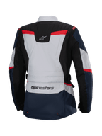 Alpinestars Stella ST-1 Waterproof Jacket, vista traseira, azul escuro e preto com detalhes em cinzento claro e vermelho vivo, casaco de aventura touring para mulher com a marca Alpinestars e construção ergonómica.