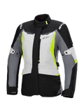 Alpinestars Stella ST-1 Waterproof Jacket, Women's Motorcycle Touring Jacket, Ice Gray, Black, and Fluorescent Yellow, featuring a high collar, front zipper, reinforced shoulders with branding, and adjustable waist straps, adventure touring-inspired design