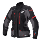 Alpinestars Stella Honda Andes V3 Drystar, casaco de touring para mulher, preto e cinzento com detalhes em vermelho vivo, com logótipo Honda Wing no peito, fechos de correr vermelhos, ajustes na cintura e nos braços, e construção impermeável durável