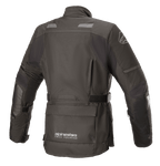 Alpinestars Women Stella Andes V3 Drystar® Jacket, Black and Dark Gray, rear view featuring waterproof textile construction, large utility pocket on the lower back, adjustable waist strap, and reflective safety accents.