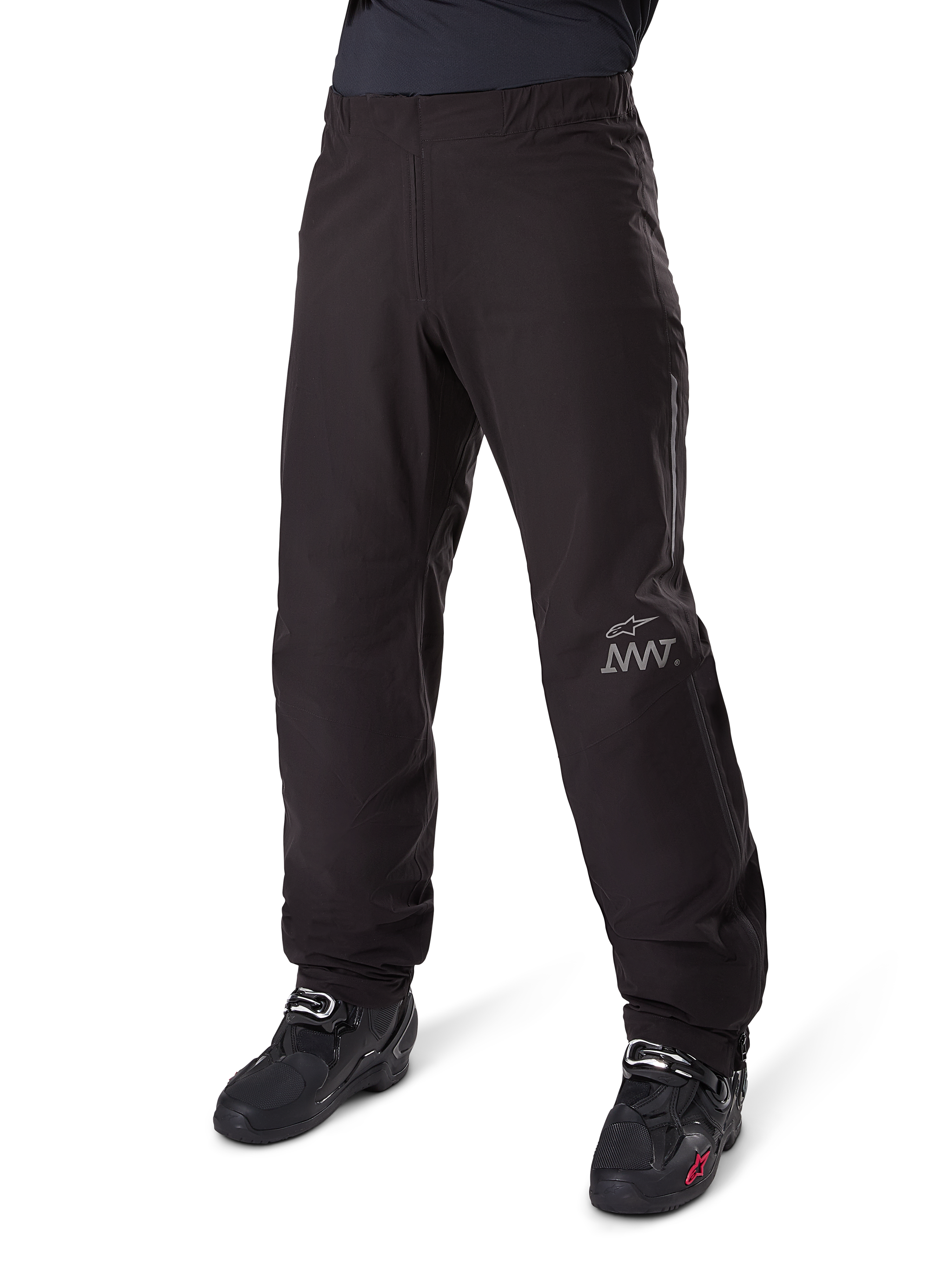 Alpinestars Amt-8 Stretch Drystar® XF Pant Liner, Black, waterproof and stretchable textile construction with silver AMT logo, worn with black riding boots, adventure touring motorcycle gear component.