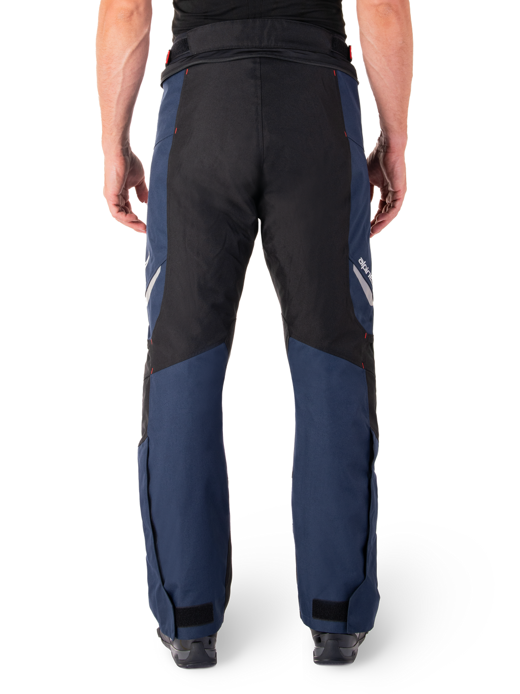 Alpinestars St-1 Waterproof Pants, Motorcycle Touring Pants, Dark Blue and Black with Bright Red accents, rear view, streamlined touring design featuring durable textile construction, reflective branding, and adjustable ankle closures.