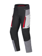 Alpinestars Honda ST-1 Waterproof Pants, Motorcycle Touring Pants, Ice Gray, Dark Gray and Black with Red Accents, technical textile construction with waterproof liner, zippered cargo pockets, and ergonomic pre-curved legs