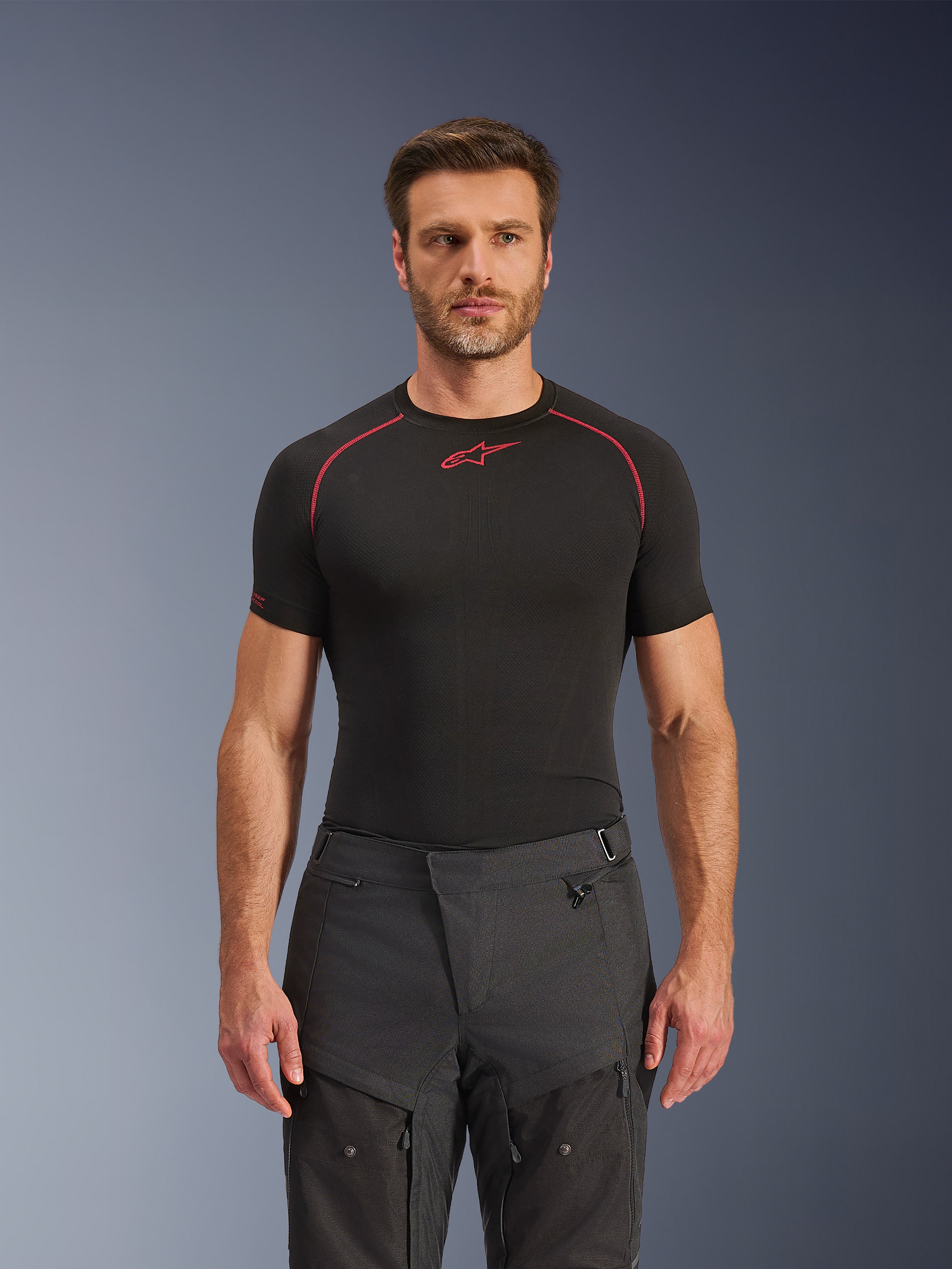 Alpinestars Cusco Drystar® Pants, Adventure Motorcycle Pants, Black, technical textile construction with zippered ventilation and ripstop panels, worn by a male model with a black Alpinestars base layer shirt for a complete adventure riding look