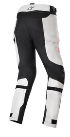 Honda Bogota' Pro Drystar® Pants, Adventure Touring Motorcycle Pants, Ice Gray and Black, rear view featuring reinforced black panels on the seat and inner legs, red side branding, and adjustable calf straps for a secure fit.