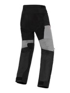Calças Alpinestars Stella Andes V4 Drystar®, calças de motociclismo de aventura para mulher, pretas e cinzento escuro, vista traseira com painéis cinzentos na parte de trás das pernas, reforços ripstop duráveis no assento e zonas elásticas para mobilidade, design têxtil impermeável.