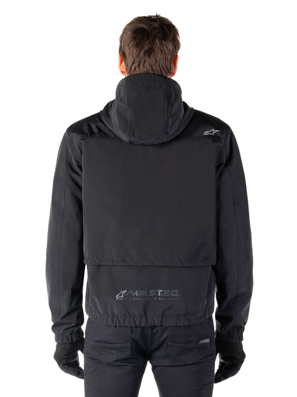 Alpinestars Mootant Waterproof Parka, Black Motorcycle Jacket, rear view showing hooded design, featuring small Astar logo on the shoulder and MO.ST.EQ. reflective branding on the lower back