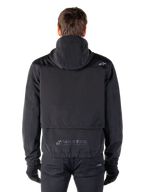 Alpinestars Mootant Waterproof Parka, Black Motorcycle Jacket, rear view showing hooded design, featuring small Astar logo on the shoulder and MO.ST.EQ. reflective branding on the lower back