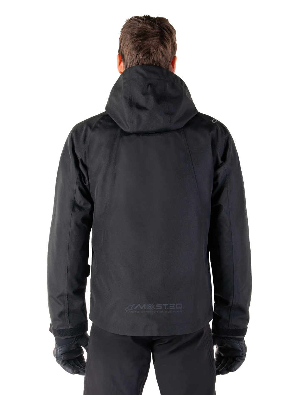 Alpinestars Morush Waterproof Parka, Black, rear view showing the hood and MO.ST.EQ. reflective logo on the lower back, minimalist urban motorcycle jacket with a streetwear-inspired design, textile riding gear for men.