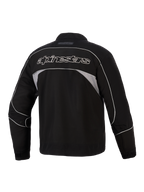 Alpinestars Unite Jacket, Rear View, Black with Dark Gray Reflective Panels, White Outlined Alpinestars Branding Across the Back, Urban Motorcycle Softshell Jacket with Minimalist Design