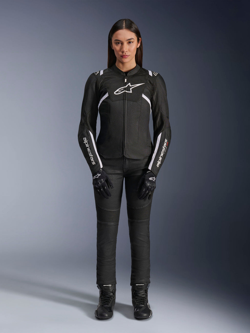 Alpinestars Stella T-Sps Air V2 Jacket, Women's Motorcycle Jacket, Black and White, featuring mesh panels and white accents, worn with black pants, gloves, and boots, athletic fit for urban riding