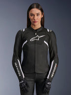 Alpinestars Woman Stella T-Sps Air V2 Jacket, textile motorcycle jacket, Black and White, featuring perforated tech mesh panels and white Alpinestars logo branding, worn by a model with black gloves, designed for ventilated summer road riding