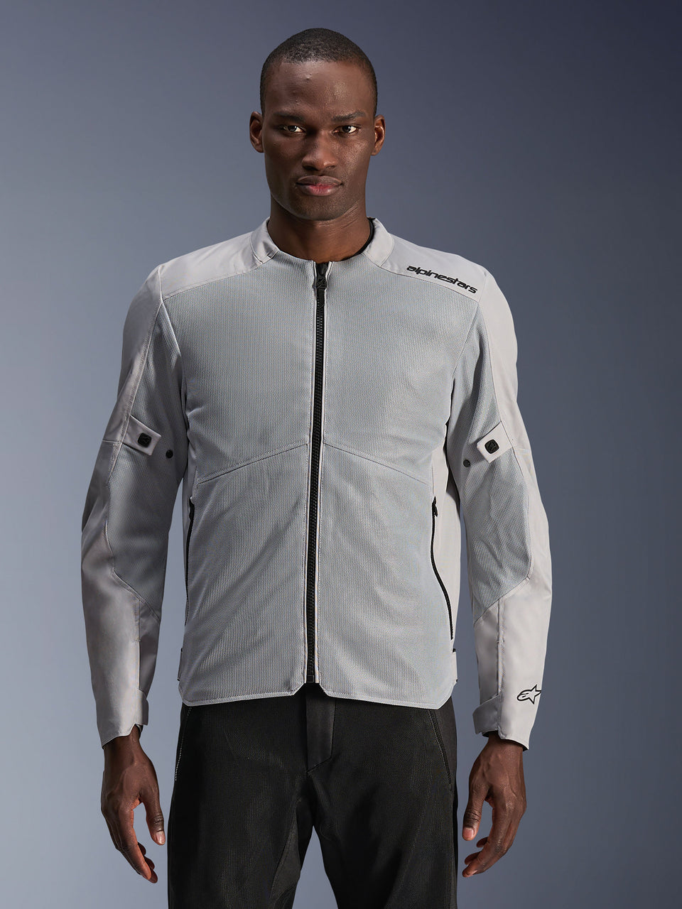 Alpinestars C-1 Air Jacket, Urban Motorcycle Jacket, Silver and Gray, featuring large tech mesh panels on the chest and sleeves, black central zipper, minimalist branding on the shoulder, lightweight and ventilated design for urban commuting