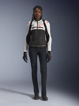 Alpinestars Stella SMX Air Jacket, Ice Gray Black and Coral Fluo, worn by a female model with black riding pants and gloves, featuring a mesh chassis and protective shoulder sliders, sport motorcycle gear for women