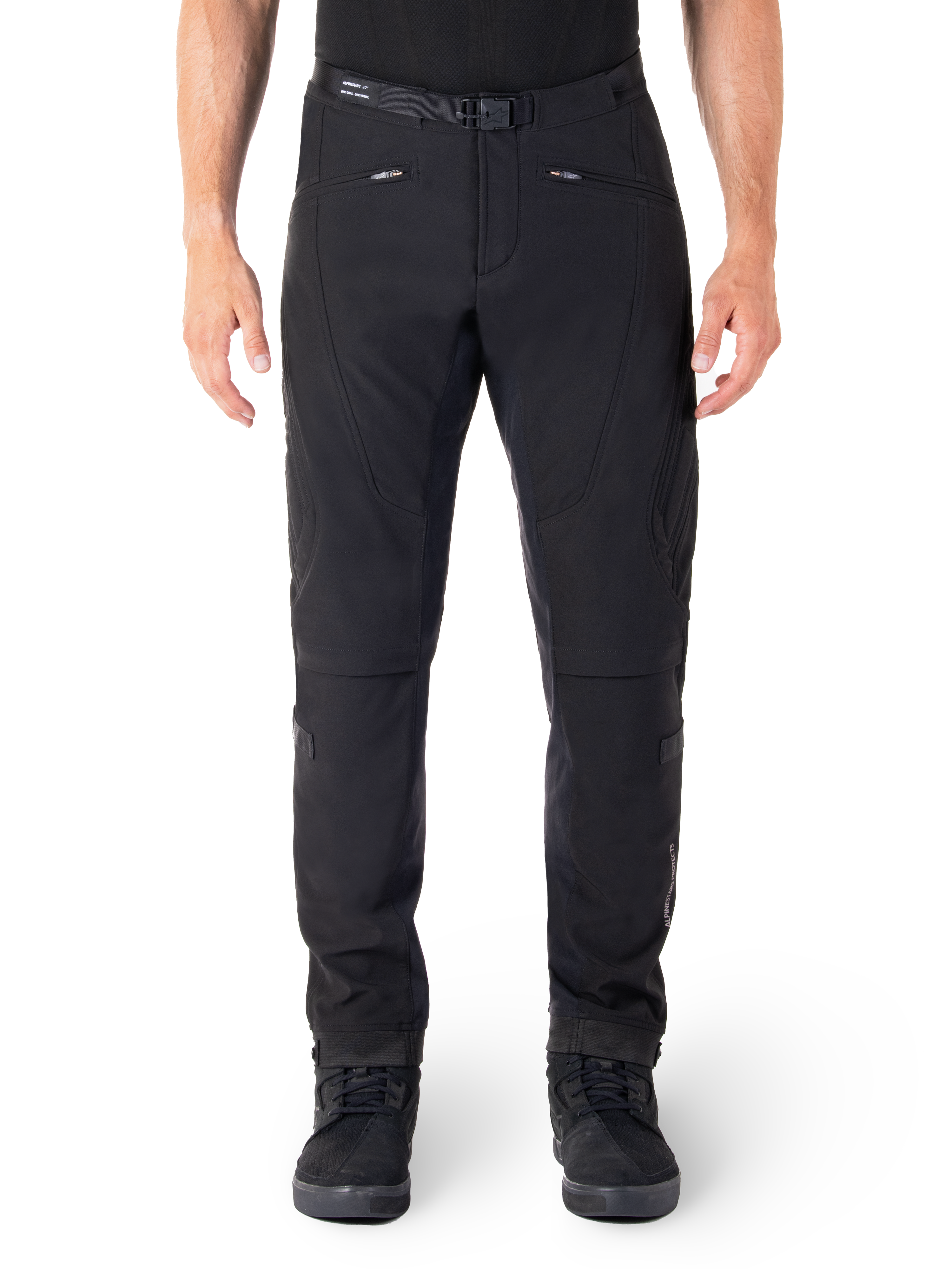 Alpinestars Alden Pants, Black Urban Motorcycle Pants, front view, technical stretch softshell fabric, integrated belt with magnetic buckle, zippered front pockets, quilted knee detailing, slim-fit silhouette, styled with black riding shoes