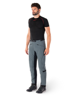 Alpinestars Alden Pants, Urban Gray technical motorcycle pants, featuring quilted side panels and black inner leg stretch fabric, styled with a black base layer and riding shoes, streetwear-inspired urban riding gear