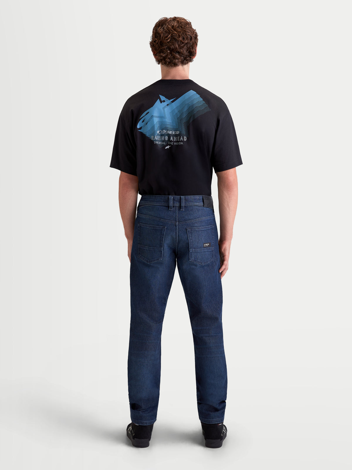 Alpinestars Flex-AST 10 Tough Max Denim Pants Short, men's urban motorcycle denim pants in dark blue, rear view on a model wearing the riding pants and a black t-shirt, AAA certified single-layer protection