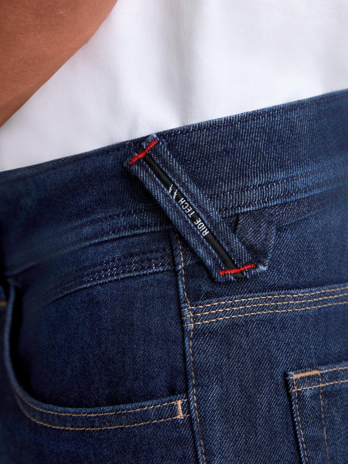 Alpinestars Flex-AST 7 Denim Pants, urban motorcycle riding pants, dark blue, close-up view of branded belt loop and reinforced stitching details