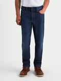 Alpinestars Flex-AST 7 Denim Pants Short, calças de moto urbanas para homem em azul escuro, vista frontal num modelo a mostrar ganga técnica de camada única e estilo casual