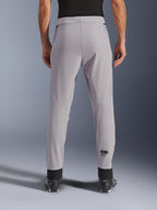 Alpinestars Aeroshell Airflow Pants, Motorcycle Pants, Mid Gray, back view showing laser-perforated zones on the calves and black Astars logo, textile softshell construction with black ankle cuffs and mesh hip panels.