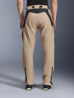 Alpinestars Acteon Pants, Urban Motorcycle Pants, Sand, rear view featuring black ripstop panels with white branding on the yoke, tapered fit with lower leg zippers, contemporary road riding gear