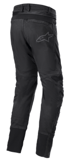 Calças Alpinestars SP Pro, calças técnicas de motociclismo desportivo em preto, vista traseira com fecho de correr de ligação na cintura, inserções elásticas RIDEKNIT na pala traseira e nas panturrilhas, logótipo subtil