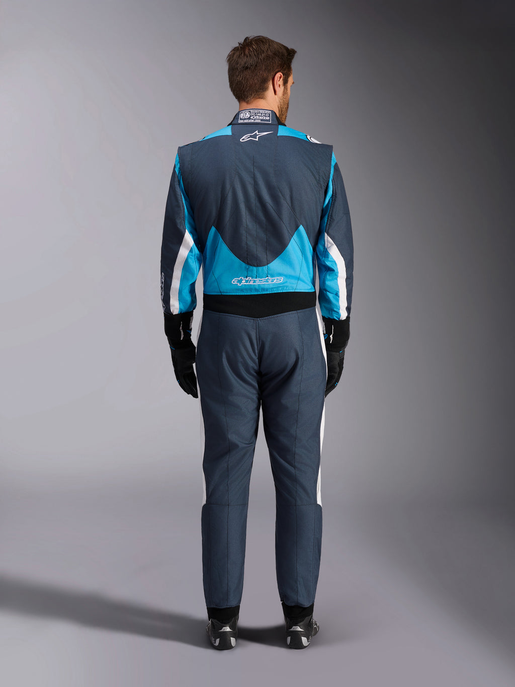 Alpinestars GP Pro Comp V2 FIA, macacão de automobilismo para homem, azul e cinzento asfalto, vista traseira.