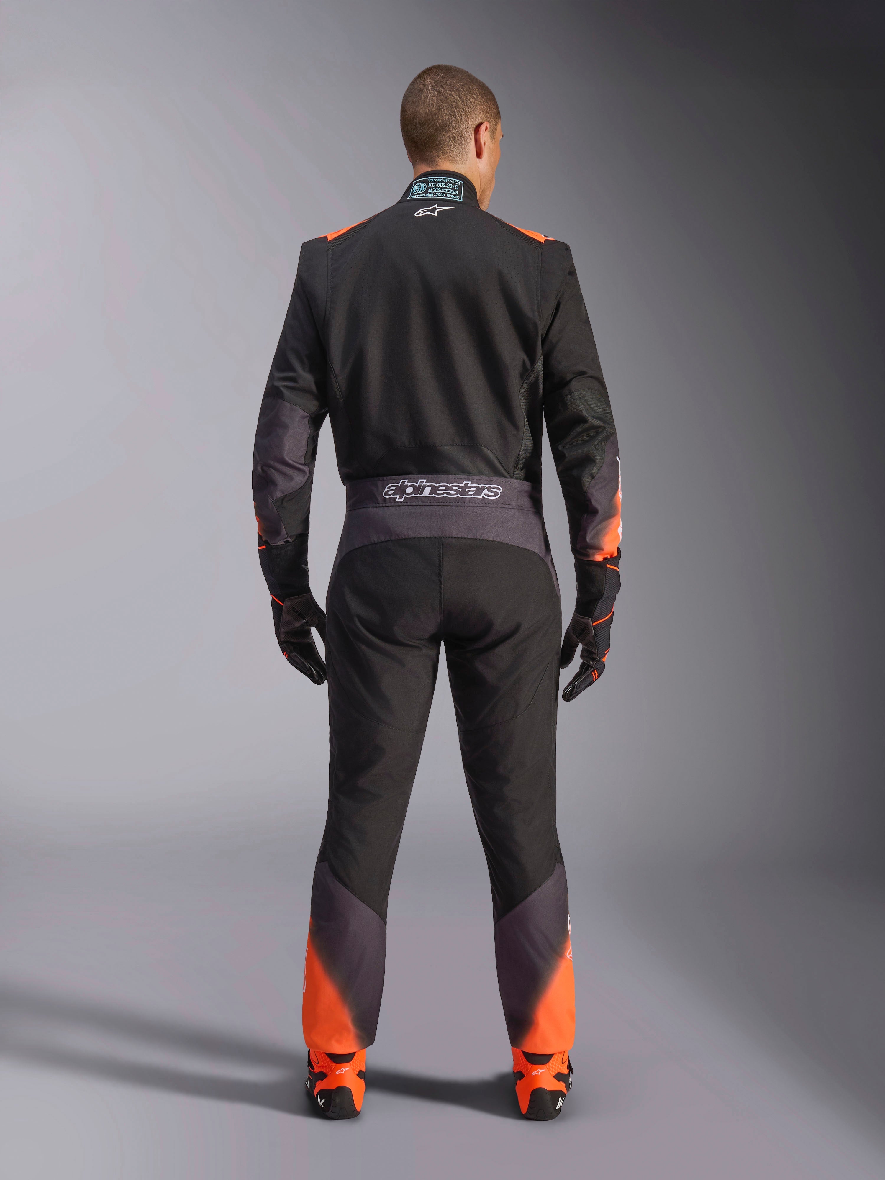 Alpinestars Macacão KMX-5 V3, macacão de karting para homem, preto e laranja fluo, vista traseira, certificado FIA.