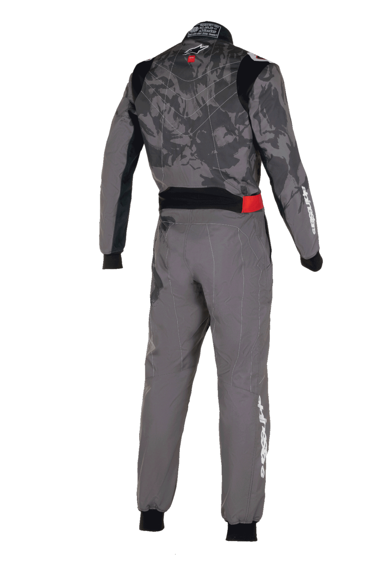 Macacão Alpinestars KMX-9 V3 Graphic 5, macacão de karting, cinzento escuro e preto, vista traseira com um padrão gráfico de camuflagem no tronco, pormenor vermelho na cintura e logótipo Alpinestars branco na manga e na perna