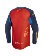 Alpinestars Maxdura Dual Jersey, camisola de motociclismo de aventura, castanho ferrugem e azul Mood Indigo com detalhes em azul brilhante, vista traseira mostrando o tronco em malha completa, bainha traseira descaída e logótipo Alpinestars em amarelo nas mangas e nas costas