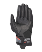 Luvas Alpinestars Corozal V3 Drystar®, pretas, cinzento escuro e vermelho fluo, vista da palma com construção em pele, reforços sintéticos na palma e punho curto com logótipo Alpinestars Adventure Tech