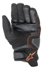 Luvas Alpinestars SMX-1 Drystar®, luvas de motociclismo, pretas e vermelho fluo, vista da palma destacando a construção em couro reforçado e camurça, zonas de aterragem acolchoadas e tira de pulso em Velcro com logótipo de estrela vermelha.