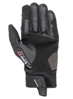 Luvas Alpinestars Hyde XT Drystar® XF, luvas de motociclismo, pretas e vermelho vivo, vista da palma mostrando a construção em camurça sintética reforçada, marca Drystar XF Extra Flow no polegar e aba de fecho de pulso ajustável.