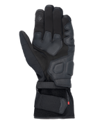 Luvas Alpinestars Tourer W-7 V2 Drystar®, luvas de motociclismo pretas, vista da palma com reforços em pele, áreas de aderência acolchoadas, ponta do dedo compatível com ecrã tátil e fecho de fita seguro no pulso.
