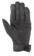 Luvas Alpinestars Syncro V2 Drystar®, luvas de motociclismo urbanas, preto e cinzento escuro, vista da palma com construção em camurça sintética, reforços acolchoados, ponta do dedo compatível com ecrãs táteis e tira de velcro no pulso com a marca Alpinestars.