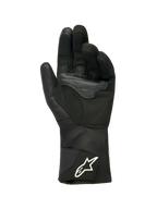 Luvas Alpinestars Stella WT-1 Drystar® Insulated para Mulher, pretas, vista da palma com camurça macia e reforço sobreposto para aderência, punho têxtil longo com logótipo Alpinestars branco na tira, pontas dos dedos compatíveis com ecrãs táteis, equipamento técnico de motociclismo para o inverno