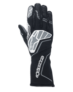 Luvas Alpinestars Tech-1 ZX V4, luvas de corrida para automobilismo, pretas e cinzento antracite, com um logótipo de estrela grande no dorso da mão e logótipo Alpinestars no punho longo, logótipo de estrela no dedo indicador, construção profissional resistente às chamas