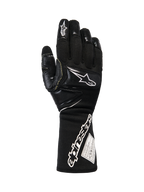 Alpinestars Tech-M V2 Gloves FIA, luvas de corrida para equipas de boxes em preto e branco, com punho longo, logótipo Alpinestars proeminente e etiqueta de certificação FIA, reforços nos nós dos dedos e dedos para proteção contra impactos, equipamento profissional de desportos motorizados