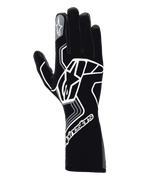 Luvas Alpinestars Tech-1 Race V4, luvas de automobilismo, Preto Tar Gray, com um logótipo de estrela geométrica branco de grandes dimensões, marca Alpinestars no punho e no dedo indicador, estilo de cano longo para desportos motorizados de alta performance