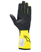 Alpinestars Tech-1 Race V4 Gloves, Auto Racing Gloves, Black and Yellow Fluo, palm view featuring textured silicone grip, extended yellow cuff with FIA certification label, high-performance motorsport gear