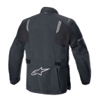 Casaco Alpinestars ST-7 2L GORE-TEX, vista traseira, preto e cinzento escuro, com painéis refletores nos ombros, logótipo da estrela Alpinestars prateado na parte inferior das costas e correias de ajuste na cintura, equipamento de motociclismo de turismo de aventura