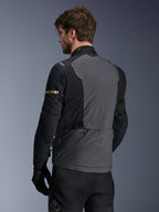 Alpinestars ST-7 2L GORE-TEX Jacket, Motorcycle Jacket, Deep Gray Black and Dark Khaki, rear view showing large gray back panel with subtle branding, black sleeves with gold-toned khaki accents, adventure-ready waterproof textile design