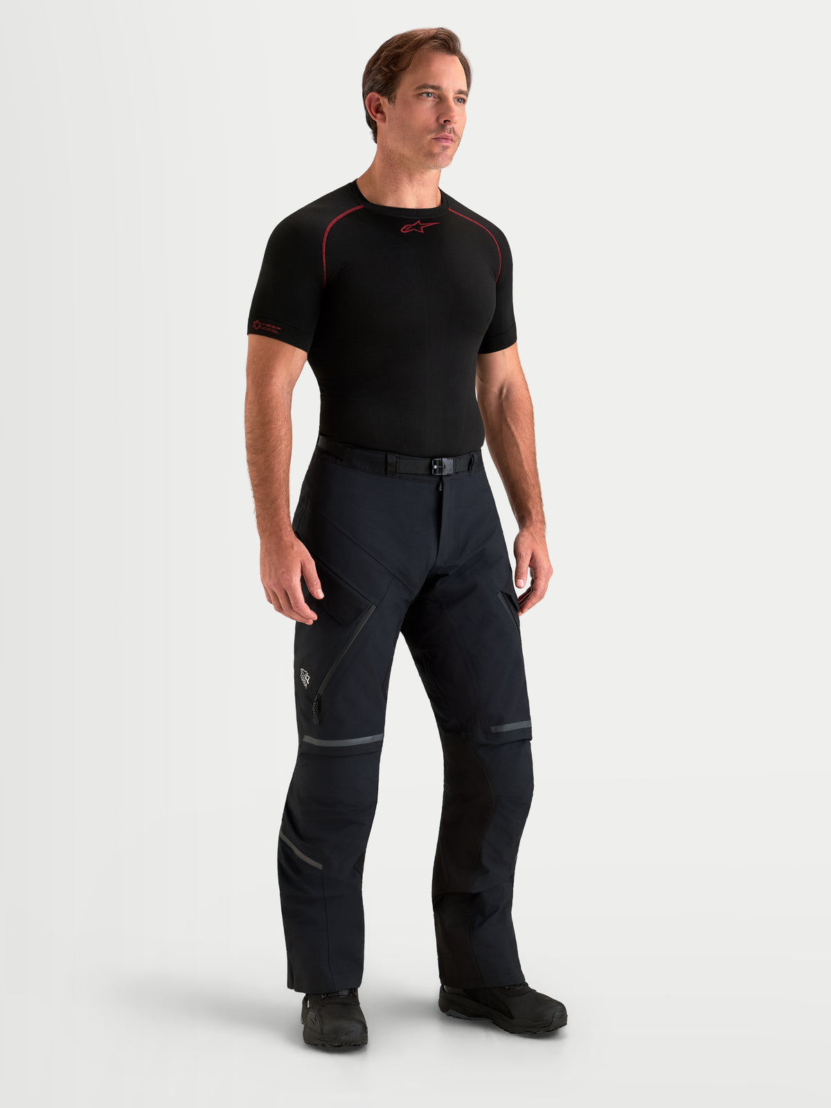 Alpinestars St-7 V2 2L Gore-Tex Pants Short, men's adventure touring motorcycle pants in black, full-length view on a model wearing waterproof textile riding gear.