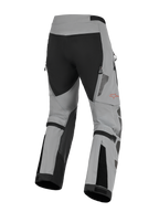 Alpinestars Nazca 3L GORE-TEX PRO Pants, Adventure Motorcycle Riding Pants, Dark Gray and Black, rear view showing calf volume adjusters and zippered exhaust vents, durable textile construction with a red Alpinestars logo on the leg