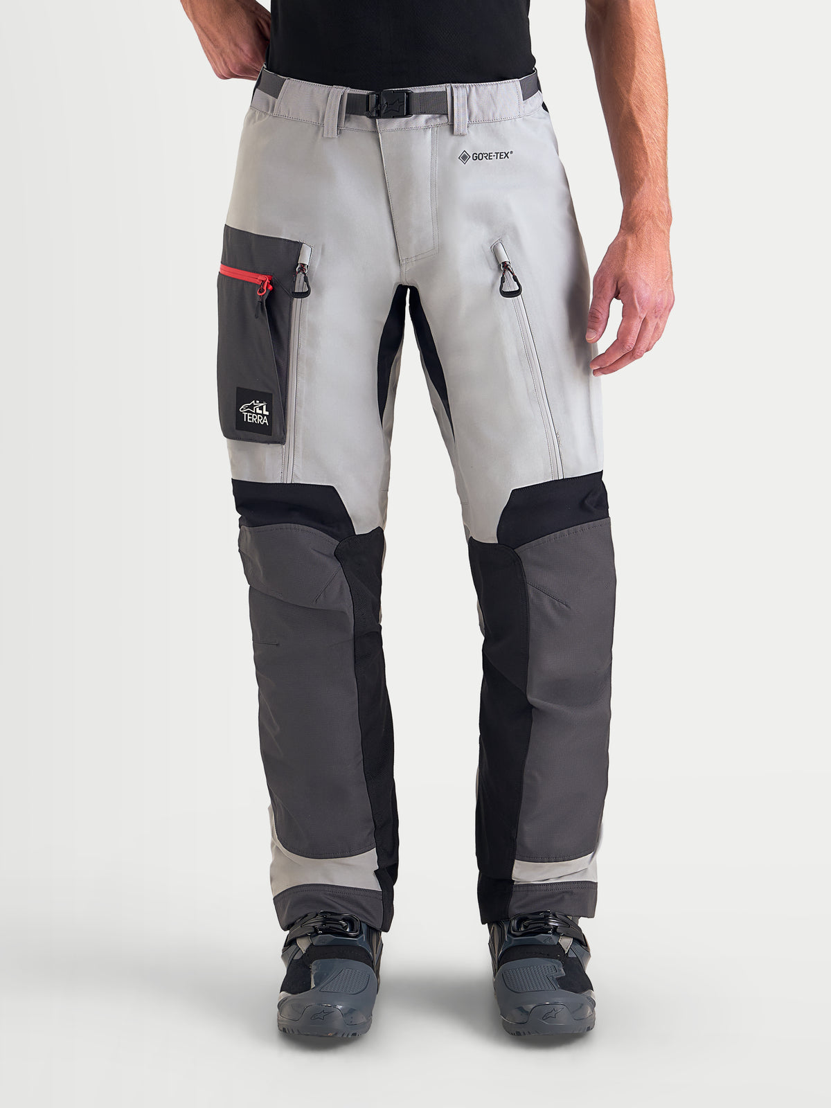 Alpinestars Arenis Gore-Tex Pants, men's adventure touring motorcycle pants in mid gray, deep gray, and black, front view on a model wearing waterproof textile gear with thigh pockets and ventilation zippers.