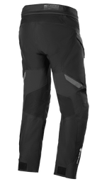 Calças Alpinestars ST-7 2L GORE-TEX, preto e cinzento escuro, vista traseira, calças impermeáveis de motociclismo para turismo de aventura com painéis reforçados, logótipo GORE-TEX na parte inferior da perna e tiras de ajuste nos tornozelos